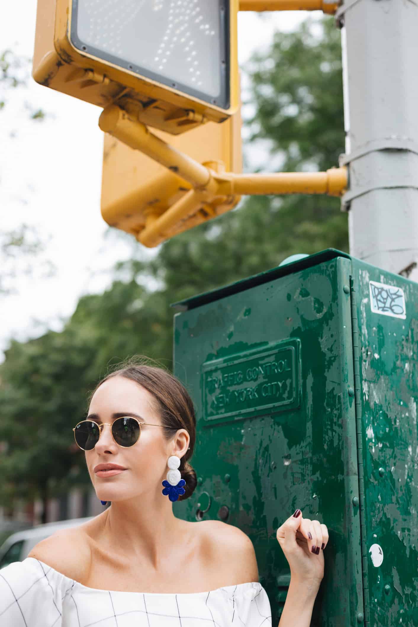 Louise Roe wearing off shoulder top in NYC