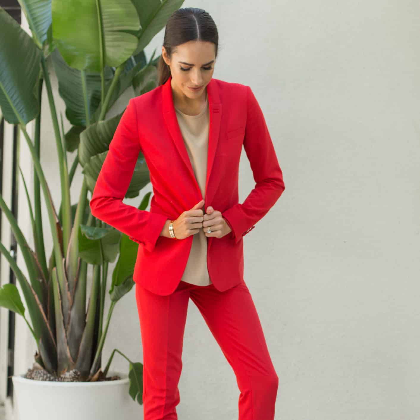Louise Roe wearing a red power suit