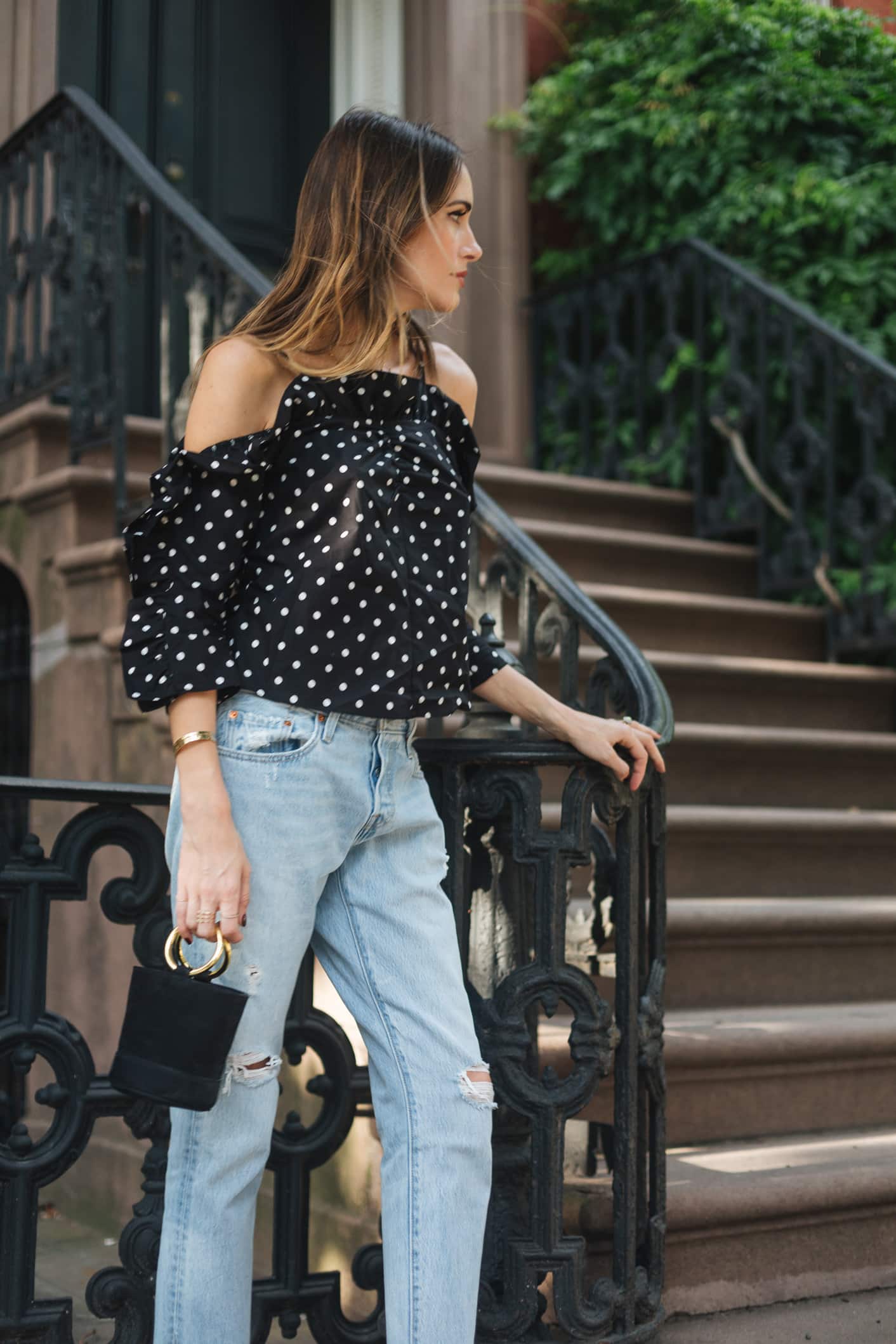Louise Roe wearing polka dot top and mom jeans in NYC