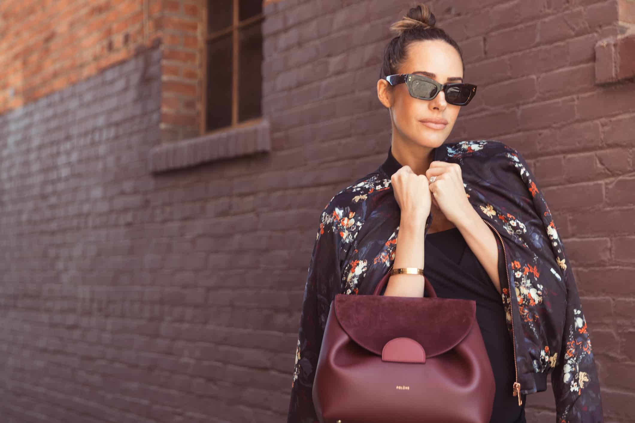 Louise Roe wearing Envie De Francaise jumpsuit Gestuz jacket Pared eyewear sunglasses Polene handbag and burgundy heels