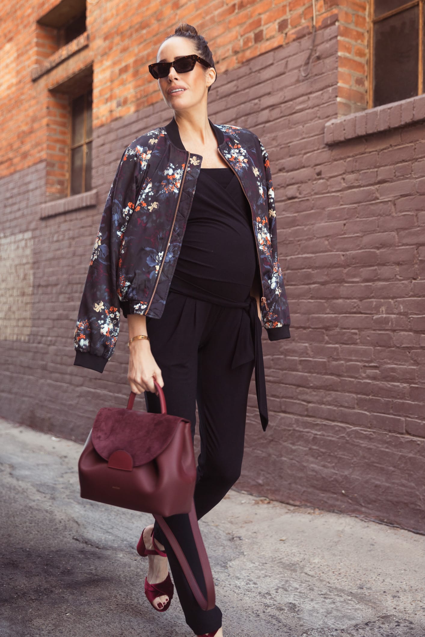 Louise Roe wearing Envie De Francaise jumpsuit Gestuz jacket Pared eyewear sunglasses Polene handbag and burgundy heels
