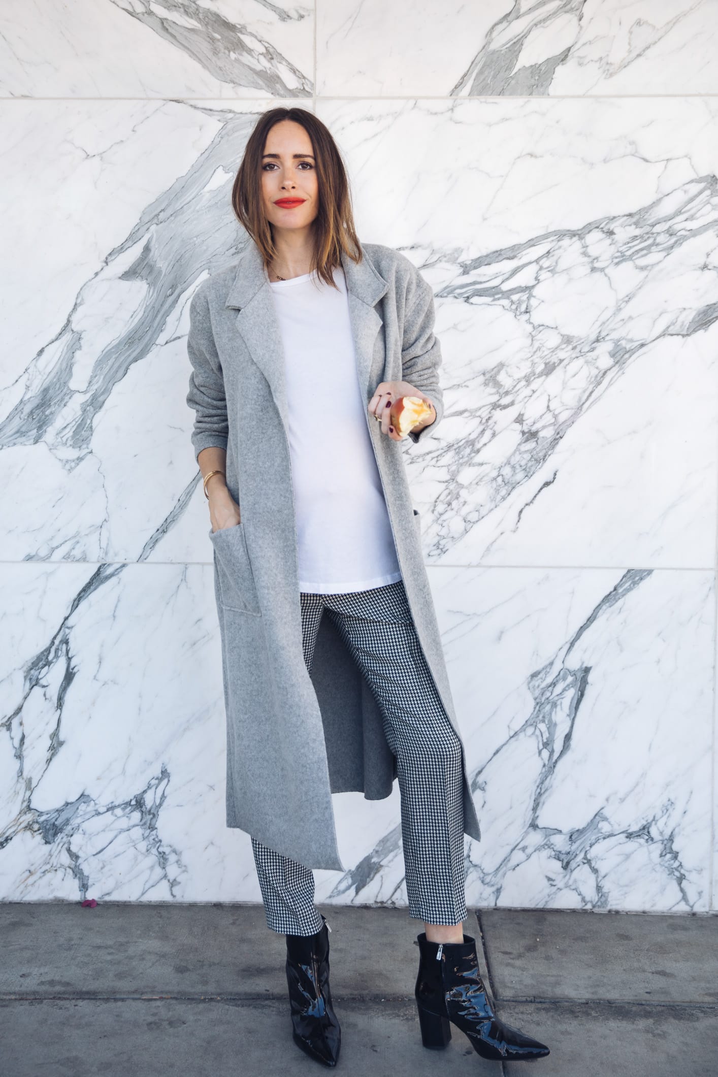 Louise Roe wearing cozy Fall coat in grey and gingham trousers