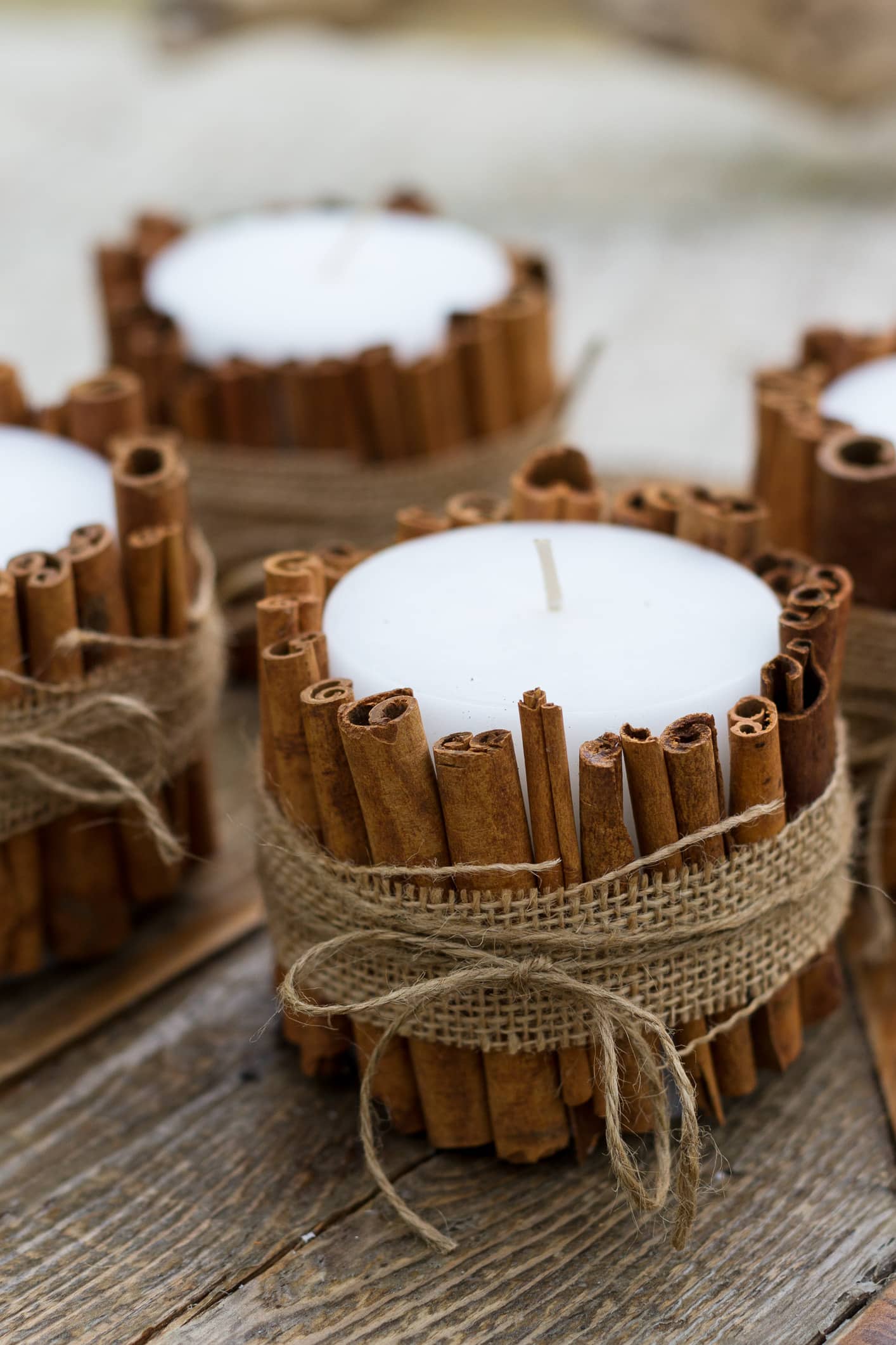 Cinnamon Stick Candles | 50 Awesome DIY Yule Decorations and Craft Ideas You Can Make for the Winter Solstice