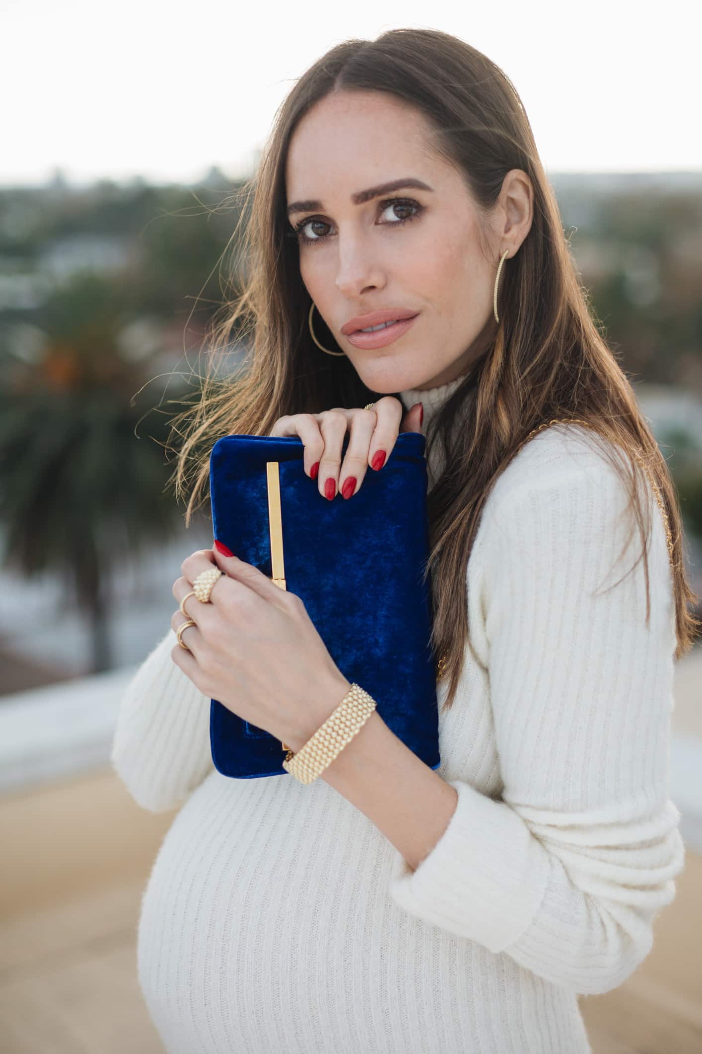 Louise Roe Wearing black and gold LAGOS jewelry for the holidays