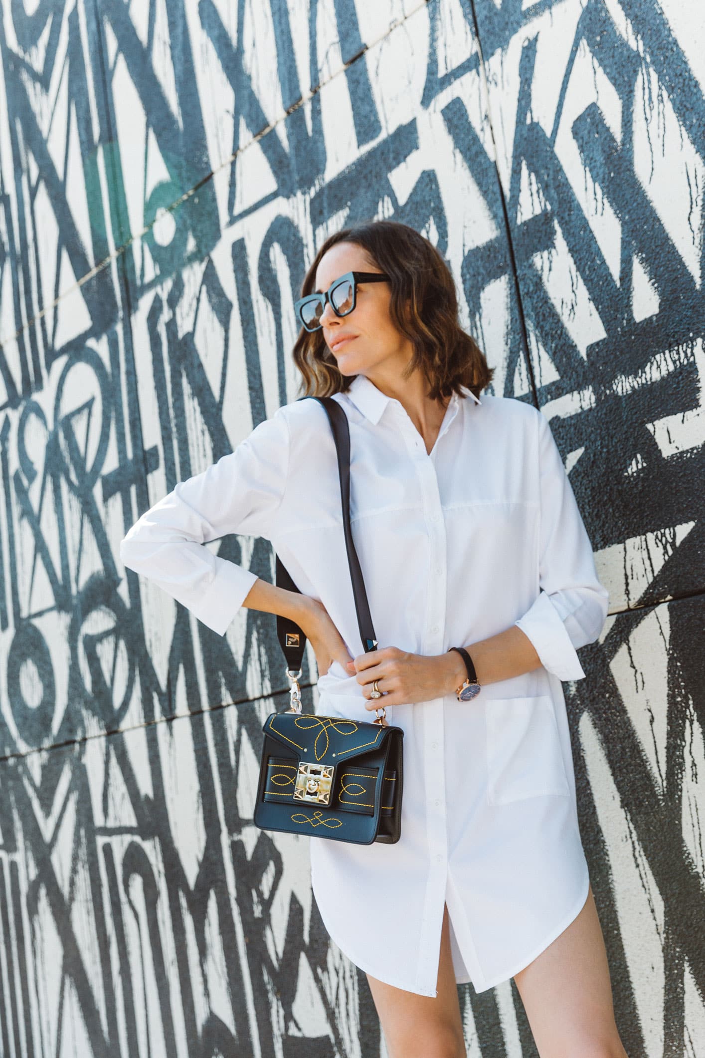 Louise Roe on the psychology of fashion wearing a white shirt dress
