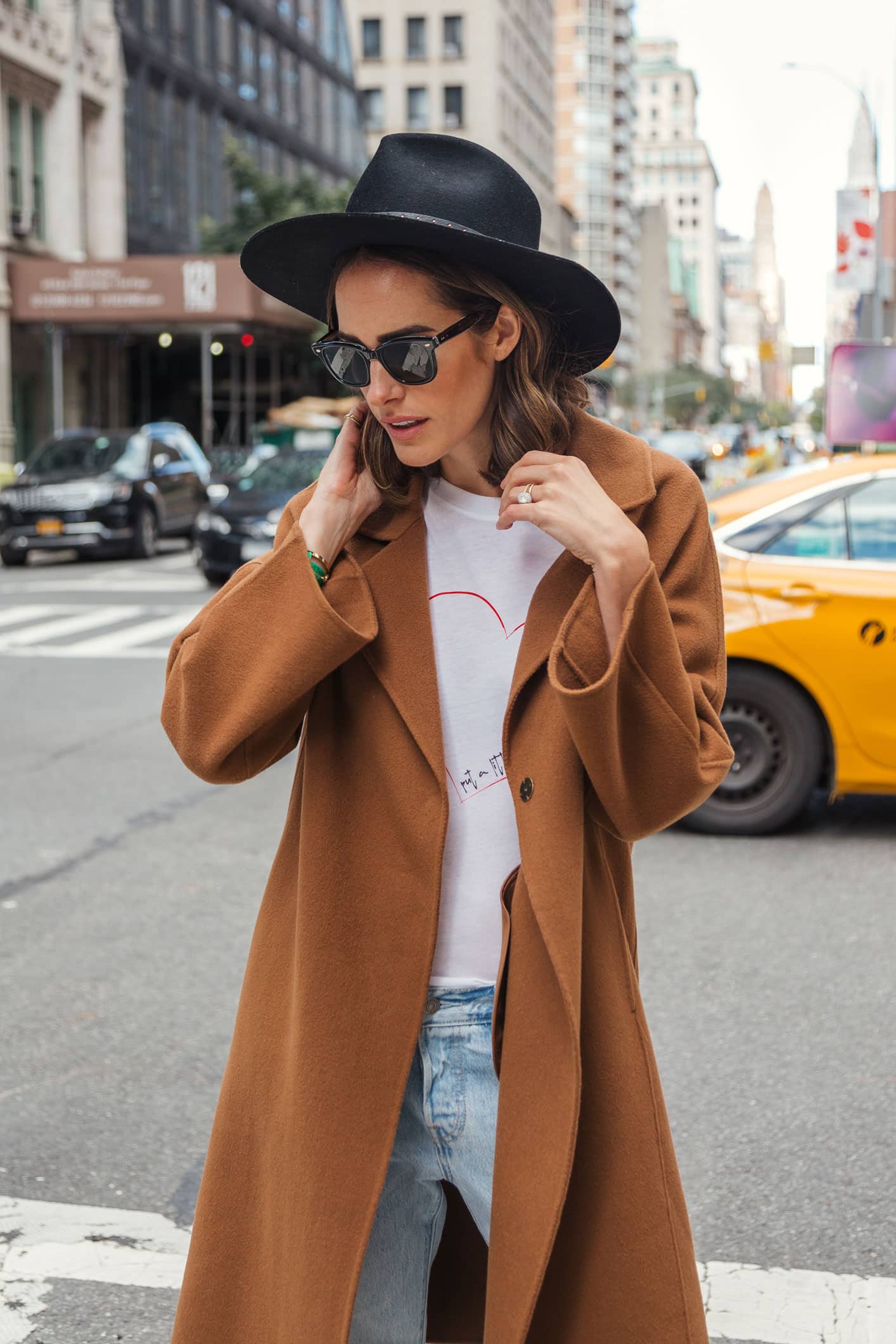 Louise Roe wearing Gerard Darel camel coat boyfriend jeans and superga sneakers in NYC