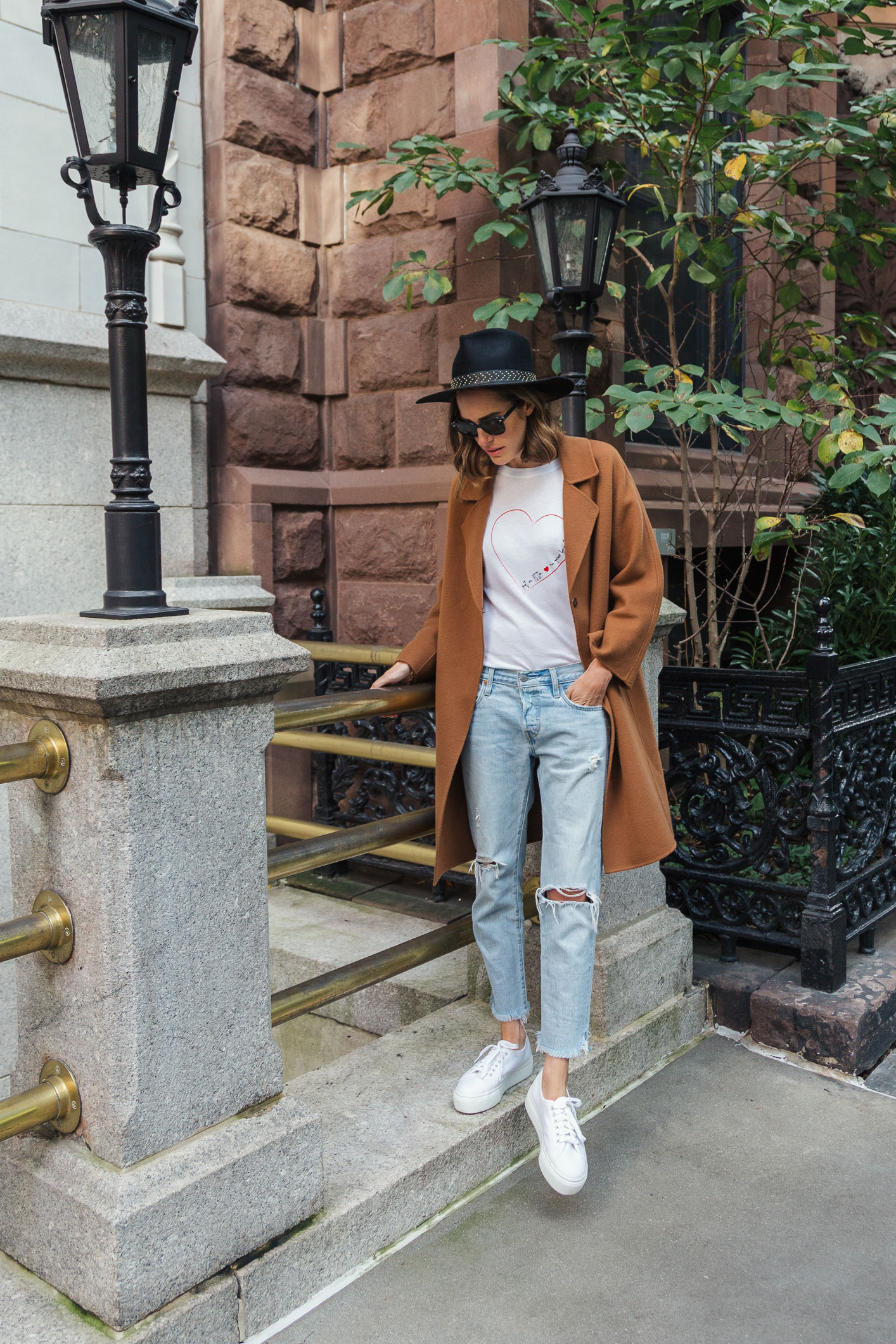Louise Roe wearing Gerard Darel camel coat boyfriend jeans and superga sneakers in NYC
