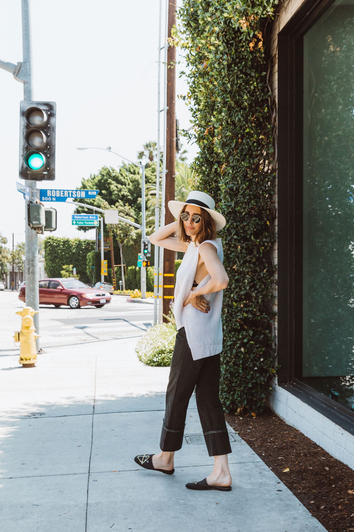 Louise Roe wearing black culotte jeans and knit tank in Los Angeles