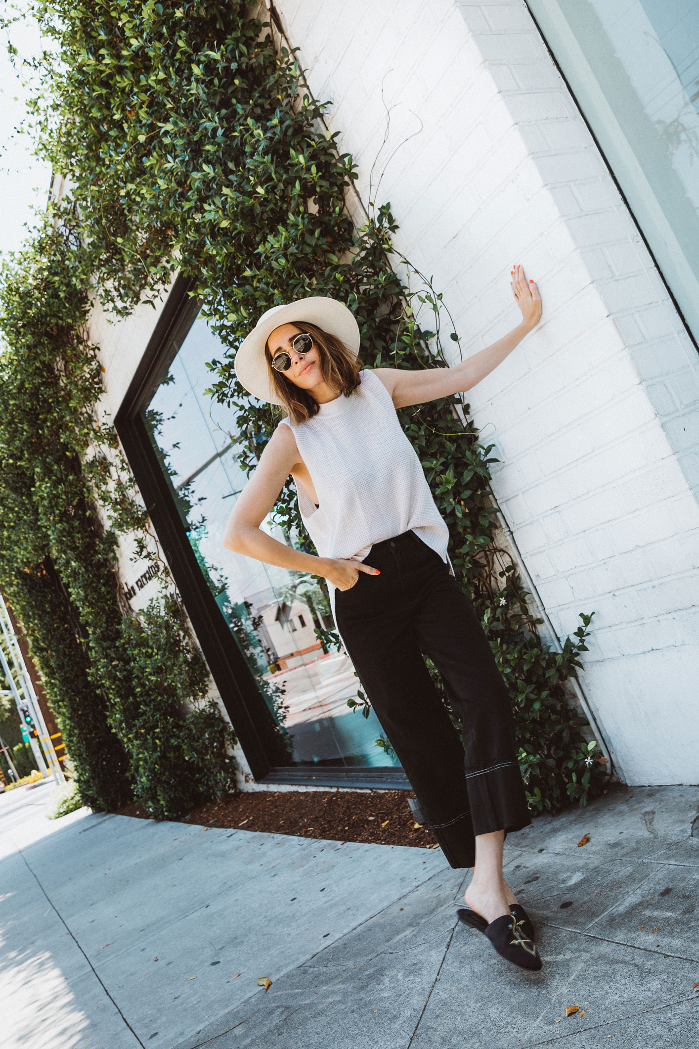 Louise Roe wearing black culotte jeans and knit tank in Los Angeles