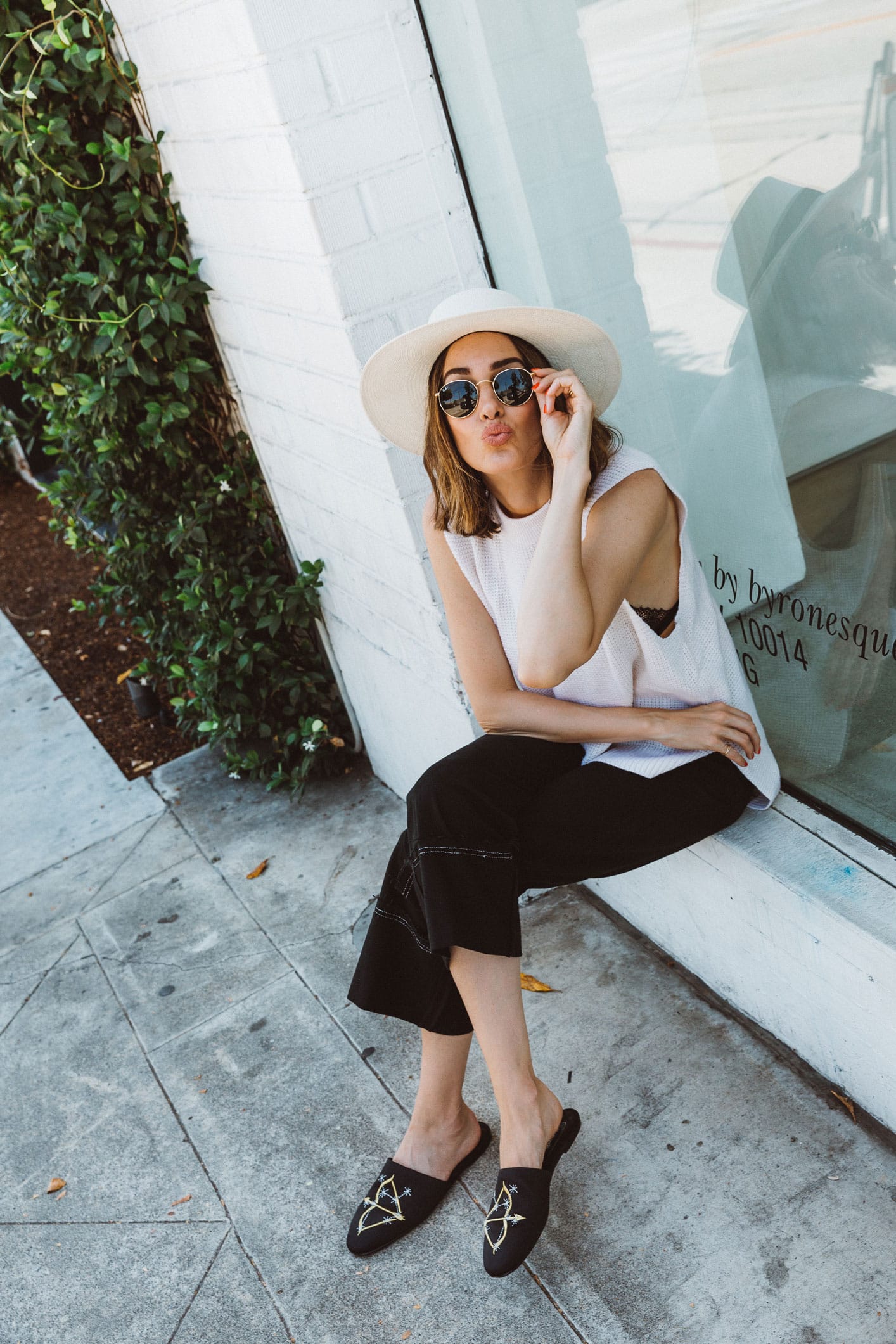 Louise Roe wearing black culotte jeans and knit tank in Los Angeles