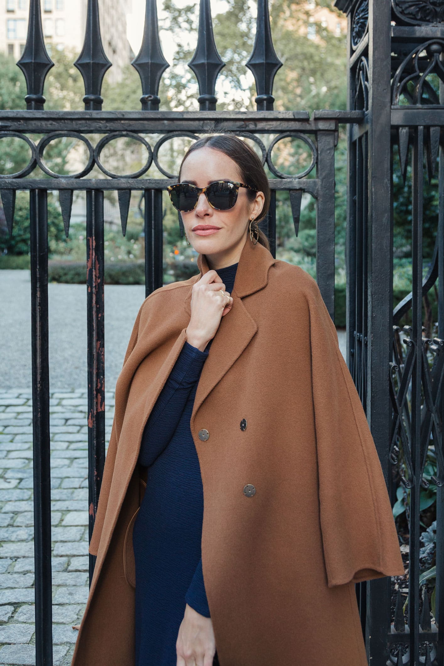 Louise Roe wearing fall outfit with navy dress and camel coat