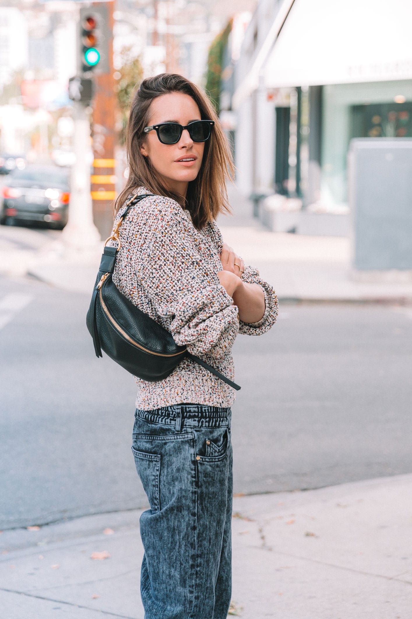 Louise Roe wearing 2019 trends stonewash jeans and chunky knit sweater